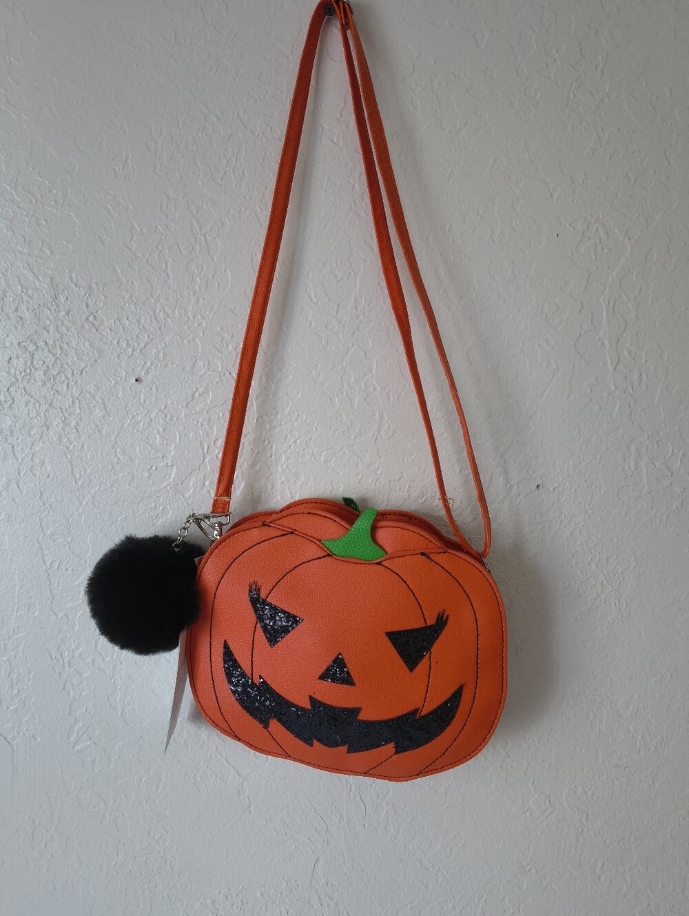 Orange Halloween Pumpkin Jack-O-Lantern Crossbody Purse Bag with Black Pom Pom.